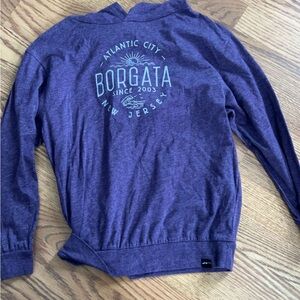 woman’s Purple Sweater